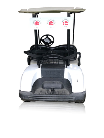 Sign plate with print to the back of a golf cart